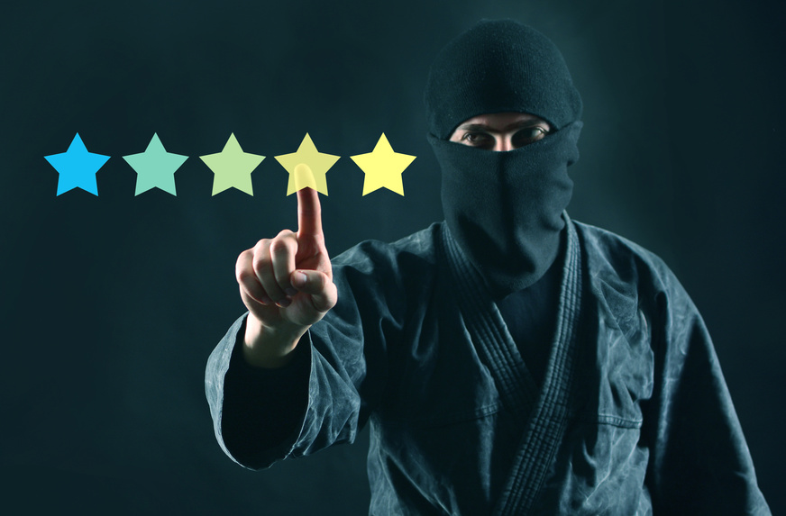 Mystery shopper or review online concept. Rating online. 5 stars review and ninja in mask on a dark background.